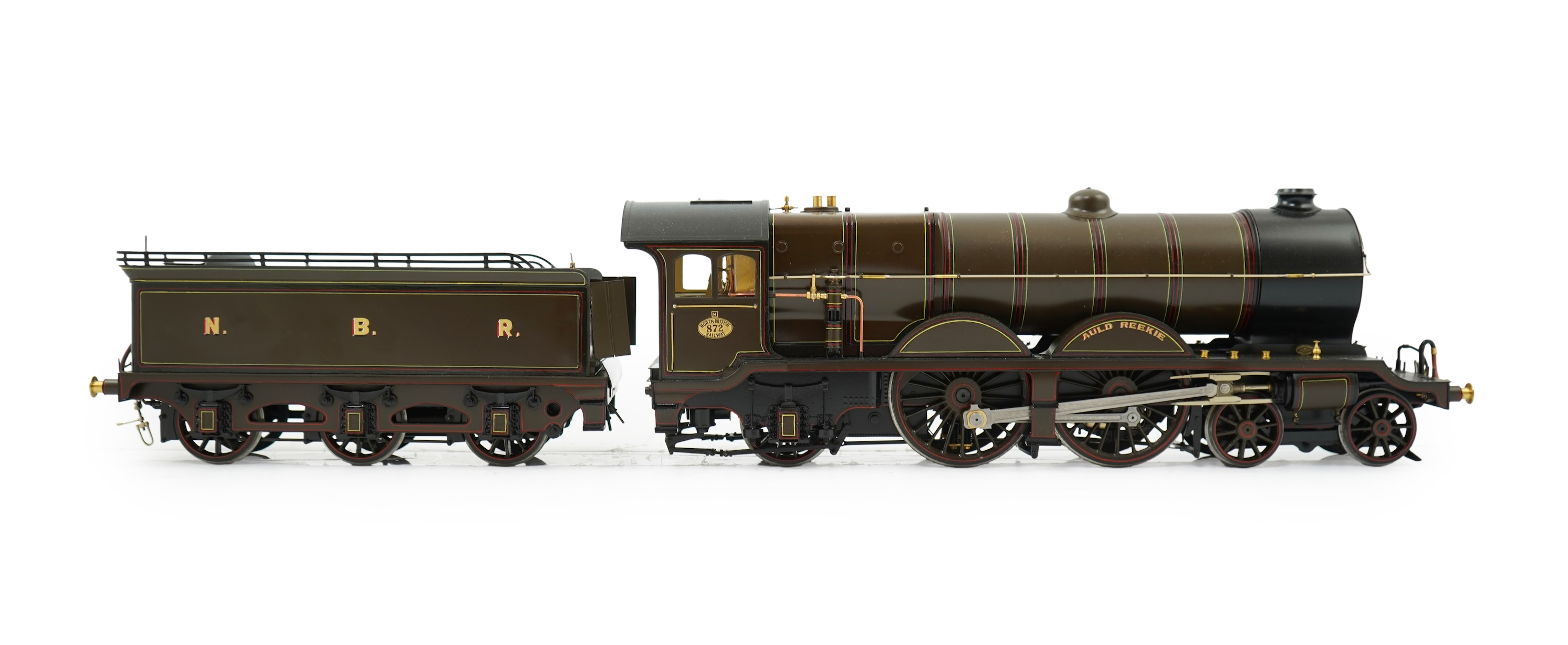 A Gauge One model of North British Railways H Class Auld Reekie 872, 4-4-2 Atlantic tender locomotive, the model has been left unpowered to allow for a high level of detailing of the valve gear and cylinders between the